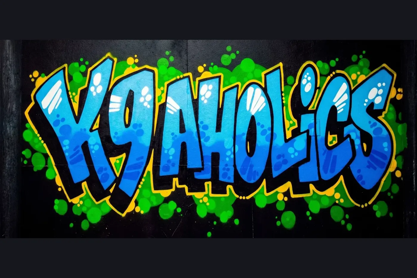 The K9aholics mural, hand painted on the wall at a location