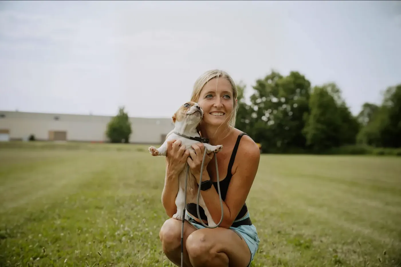 Trainer holding a puppy