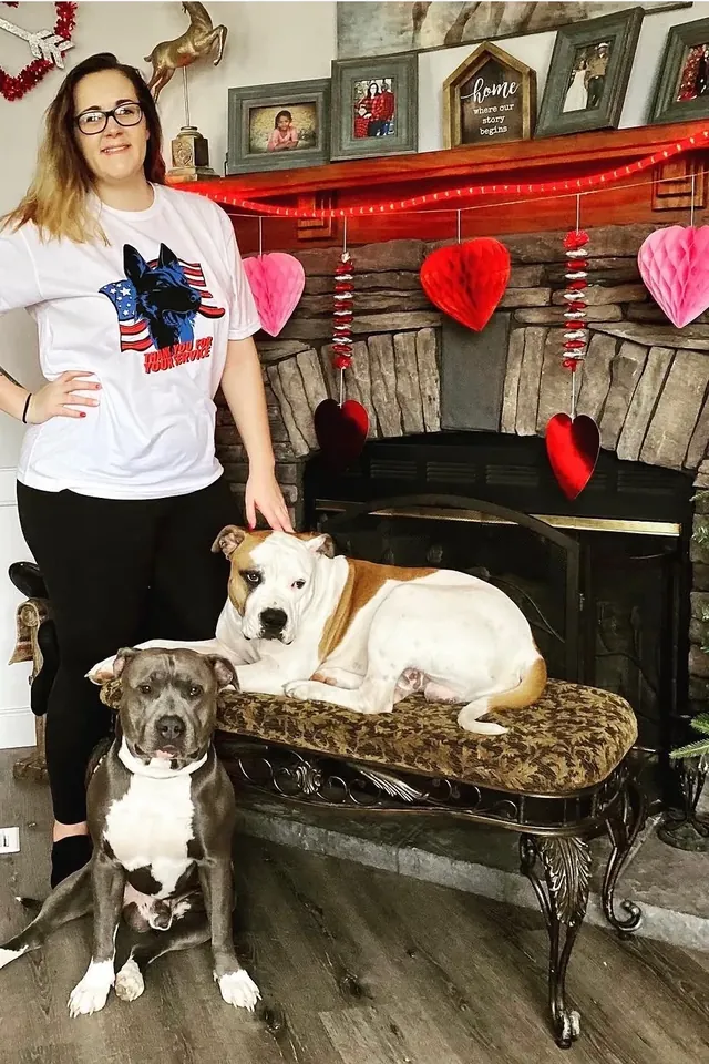 K9aholics trainer at home with two dogs